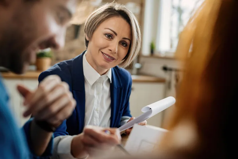 Property adviser discussing documents during a consultation
