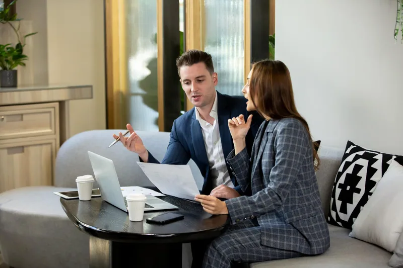 Couple working through property plans together at home